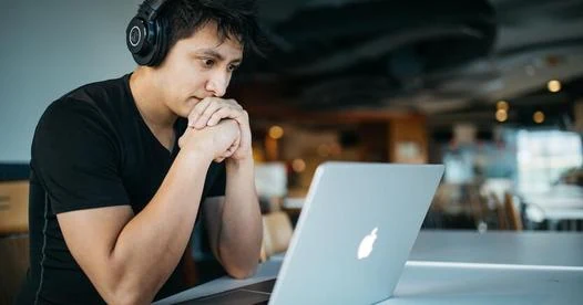 College student working on MacBook