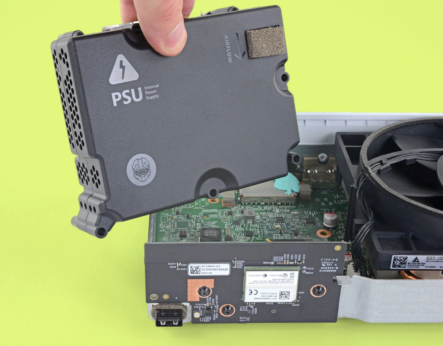 An Xbox Series S’s internal components with PSU and cooling fan visible