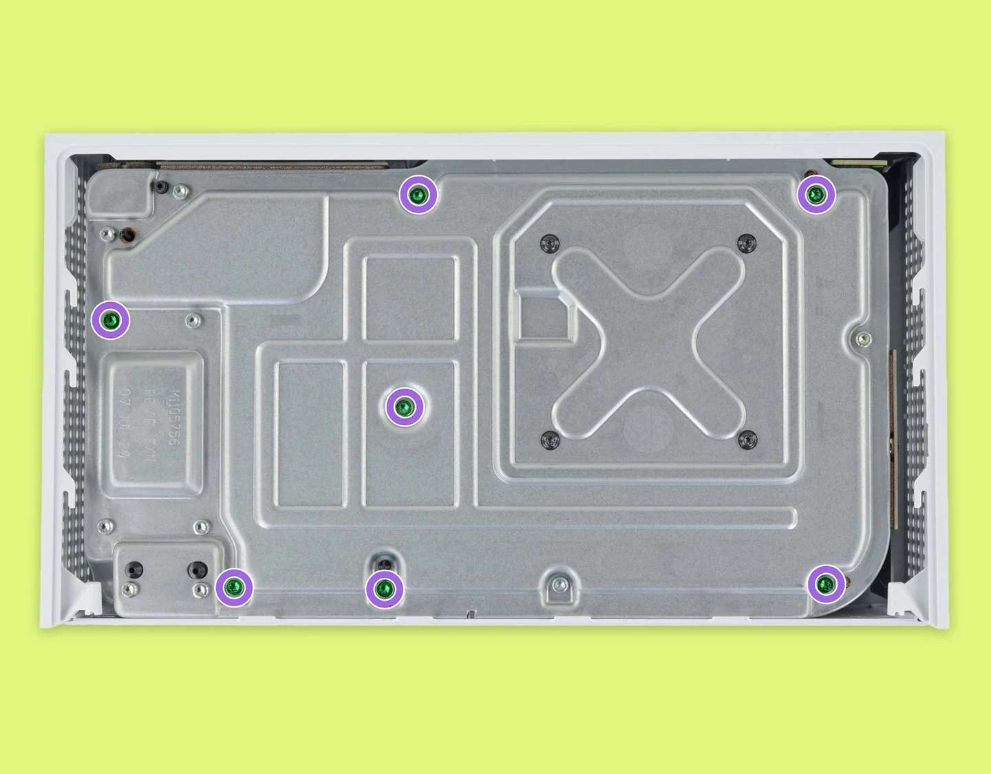 An Xbox Series S internal chassis with the seven green screws highlighted.