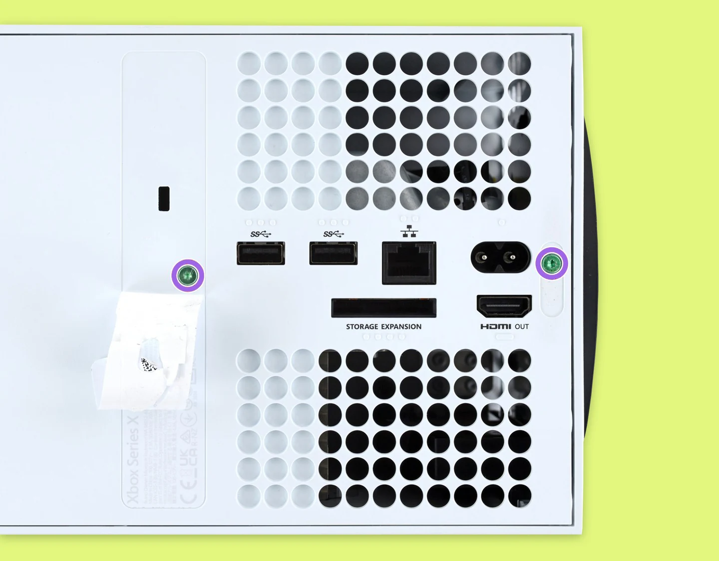 The back panel of the Xbox Series X with screws highlighted